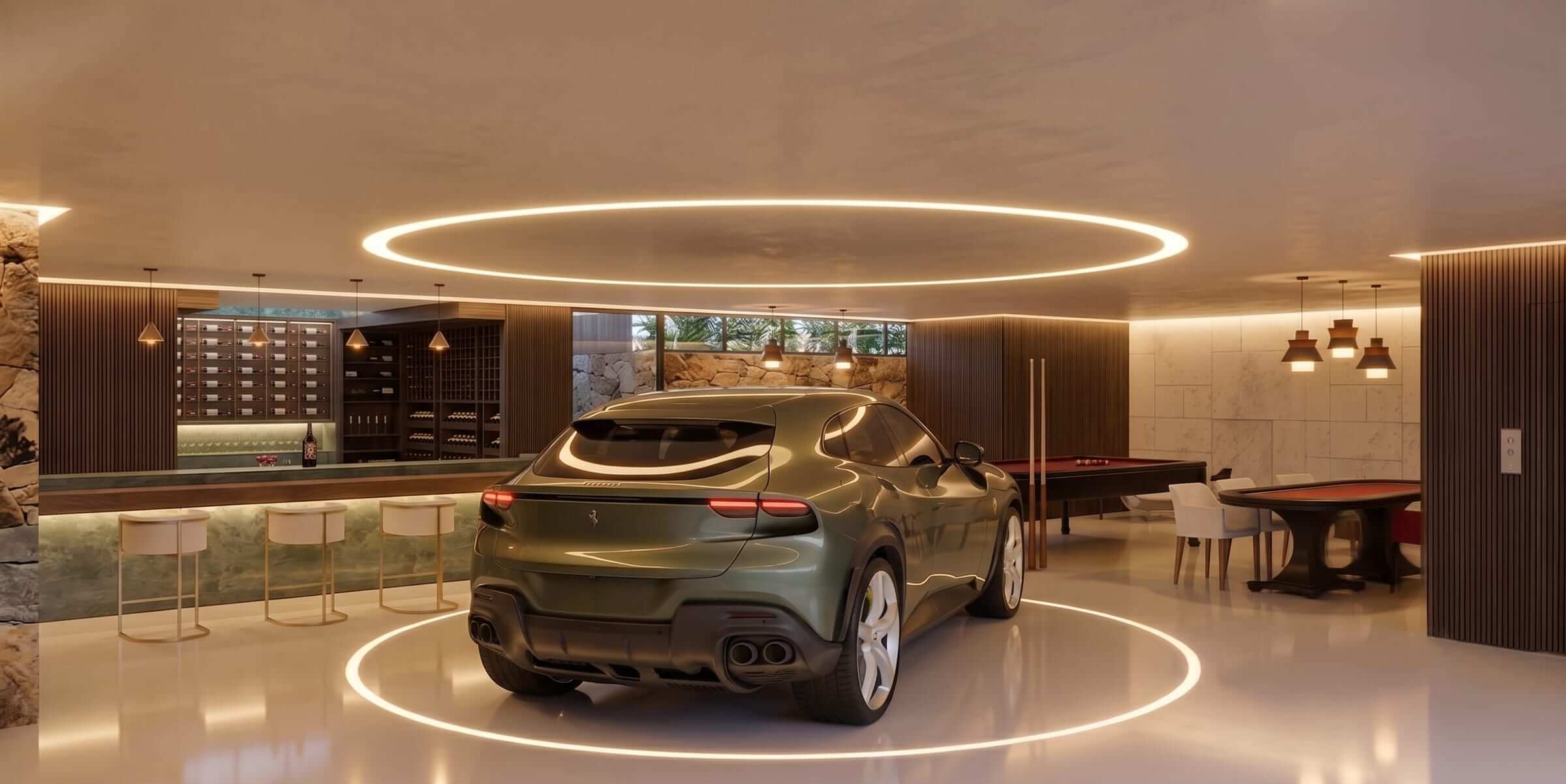 The display garage beneath a ring of ceiling light, with the game room's bar and pool table alongside.