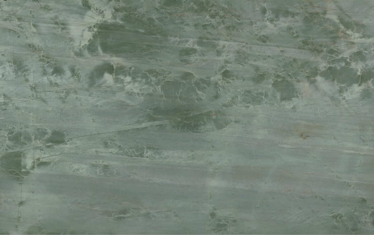 A slab of emerald marble with deep green veining.