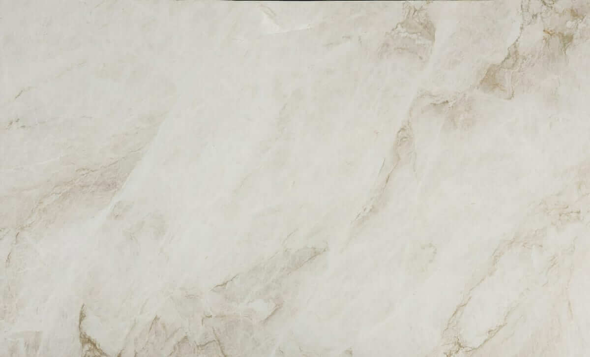 A slab of Taj Mahal marble with golden veining over a light, translucent base.